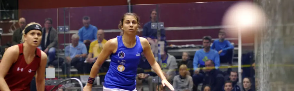 Two professional squash players battle for supremacy