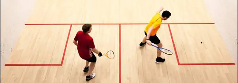 Two men playing squash