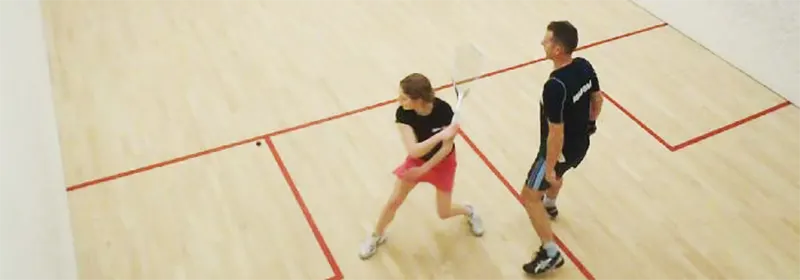 Two players on a squash court