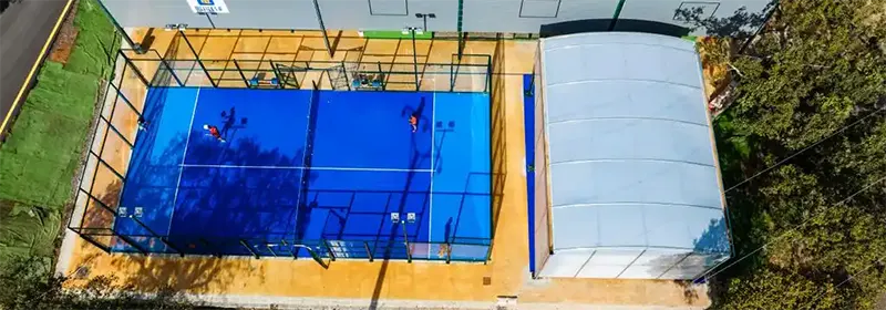 Overhead view of the squash plus squash court, next to a padel court.