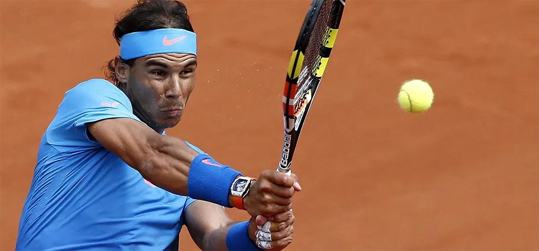 Rafael Nadal hitting a backhand shot with two hands