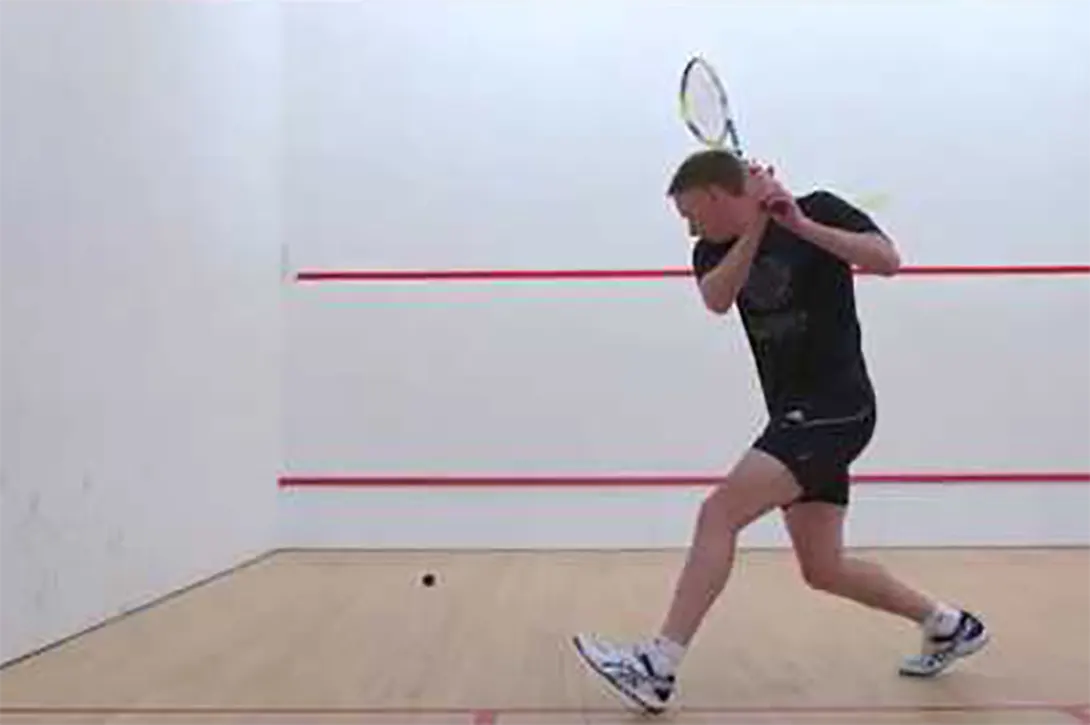 Peter Marshall hitting the ball using two hands