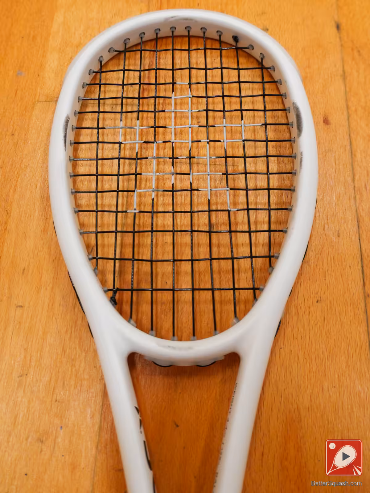 A close up of the Master Athletics Squash Training Racquet throat area