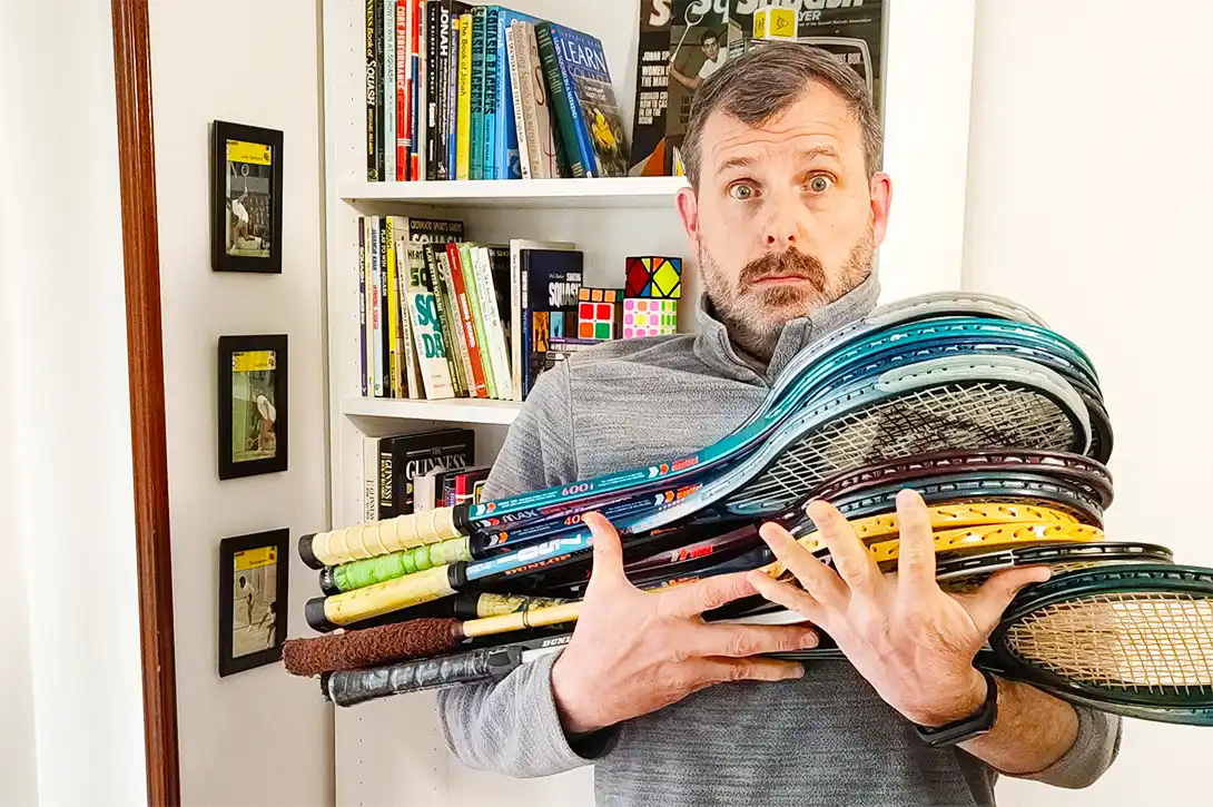 Me holding some of my vintage squash rackets