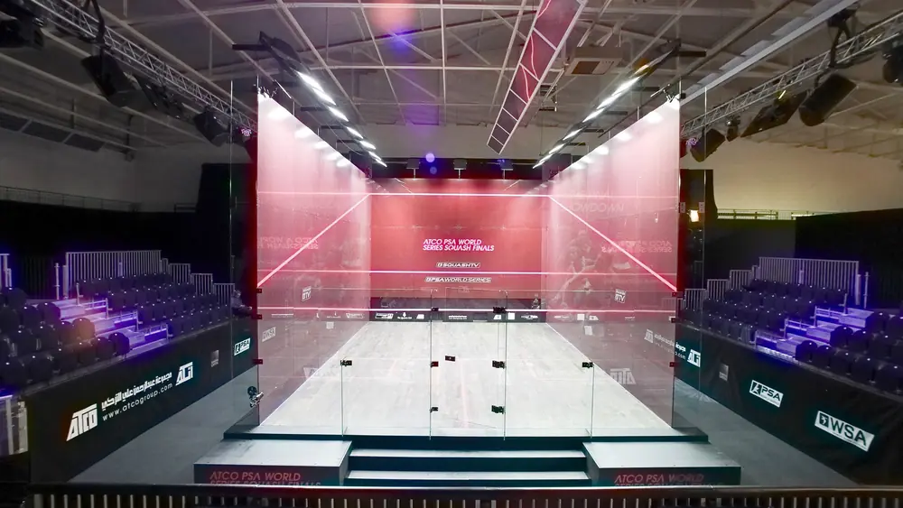 An all-glass squash court, in an empty arena