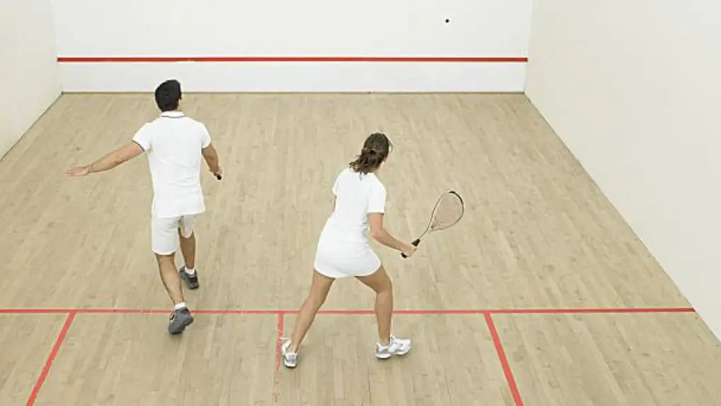 Two squash palyers in white clothing
